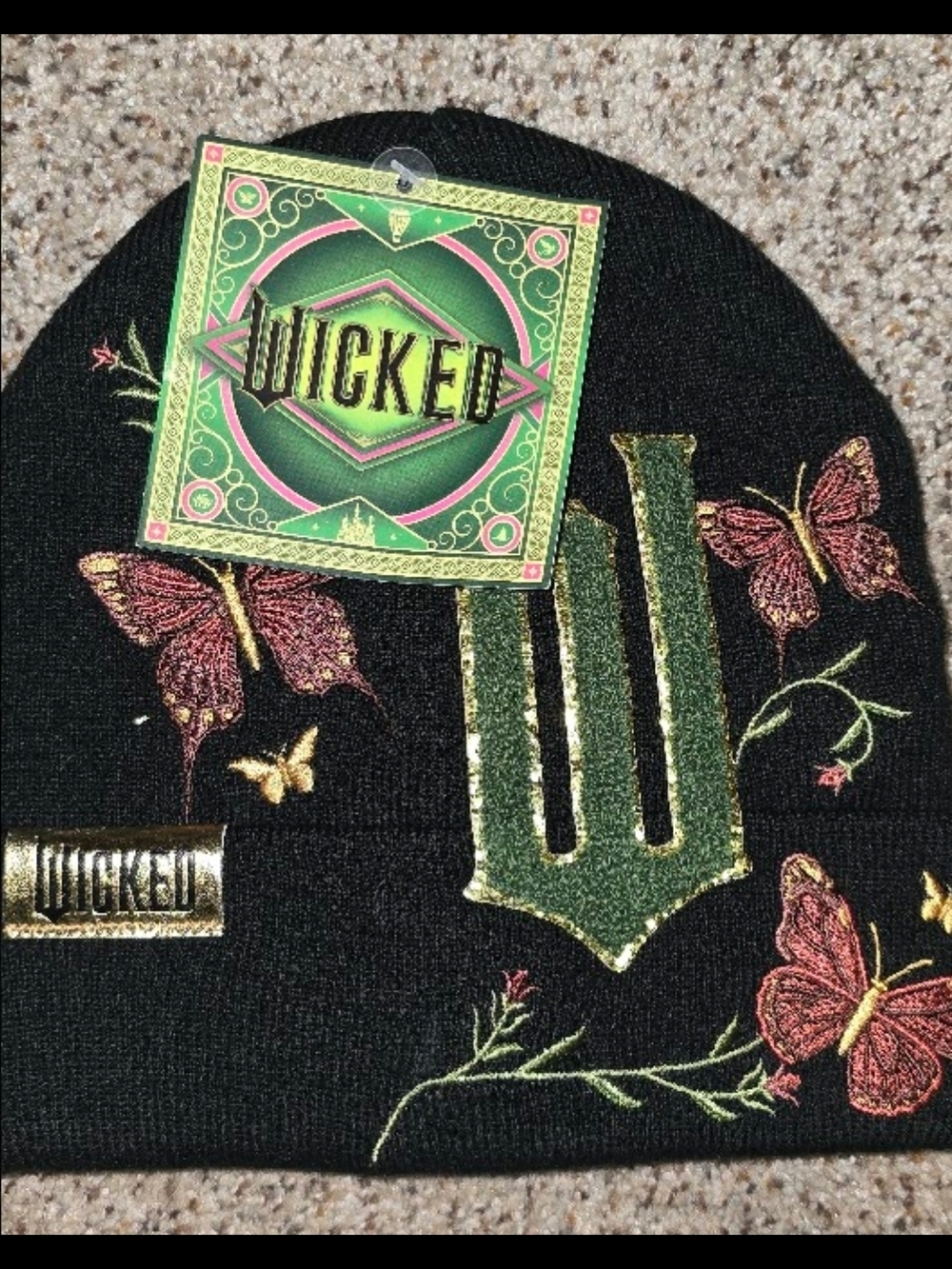 Wicked Embroidered Black Beanie with Green 'W' Logo and Pink Butterflies
